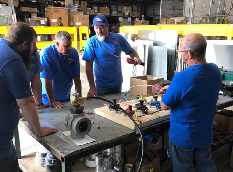 guys having a meeting about propane parts